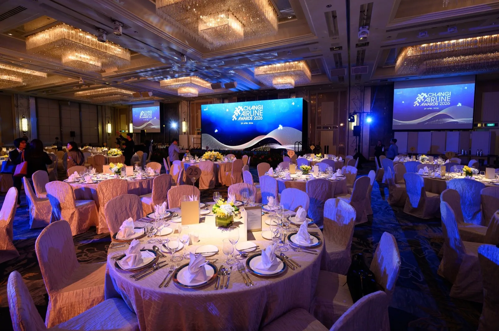 Set dining tables facing the Changi Airline Awards stage