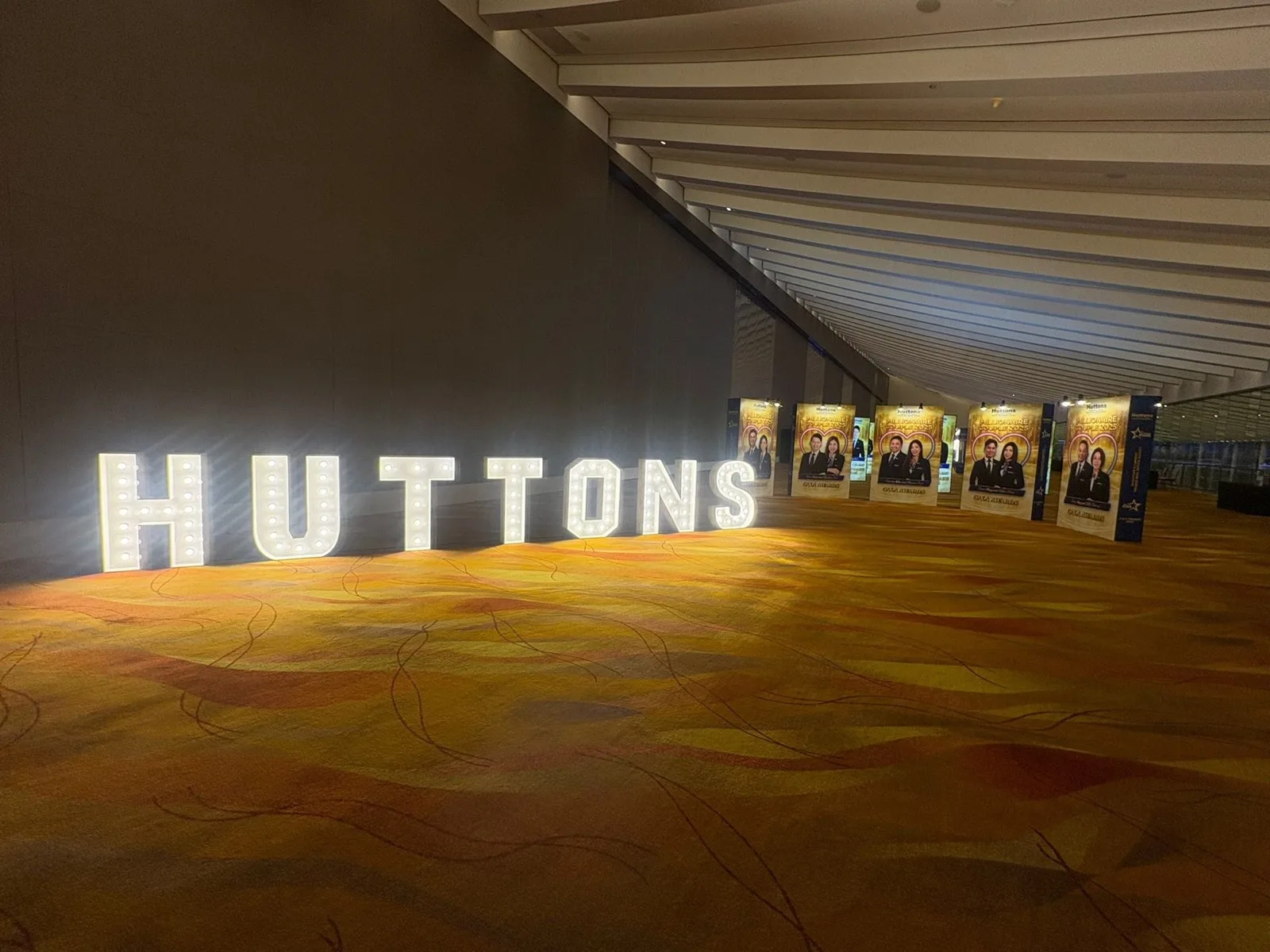 Illuminated Huttons letters and recognition walkway at Huttons Convention Awards and Gala Dinner 2026