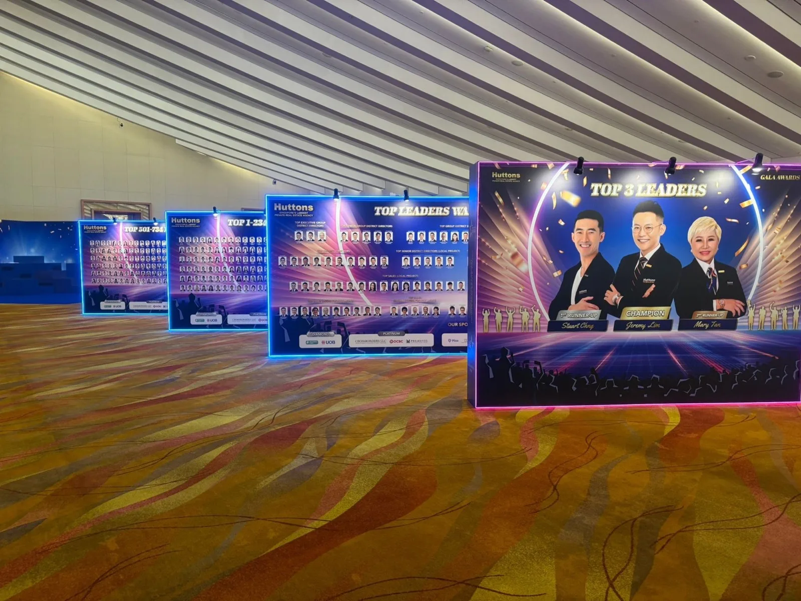 Top leaders and award recipient displays along the Huttons walkway
