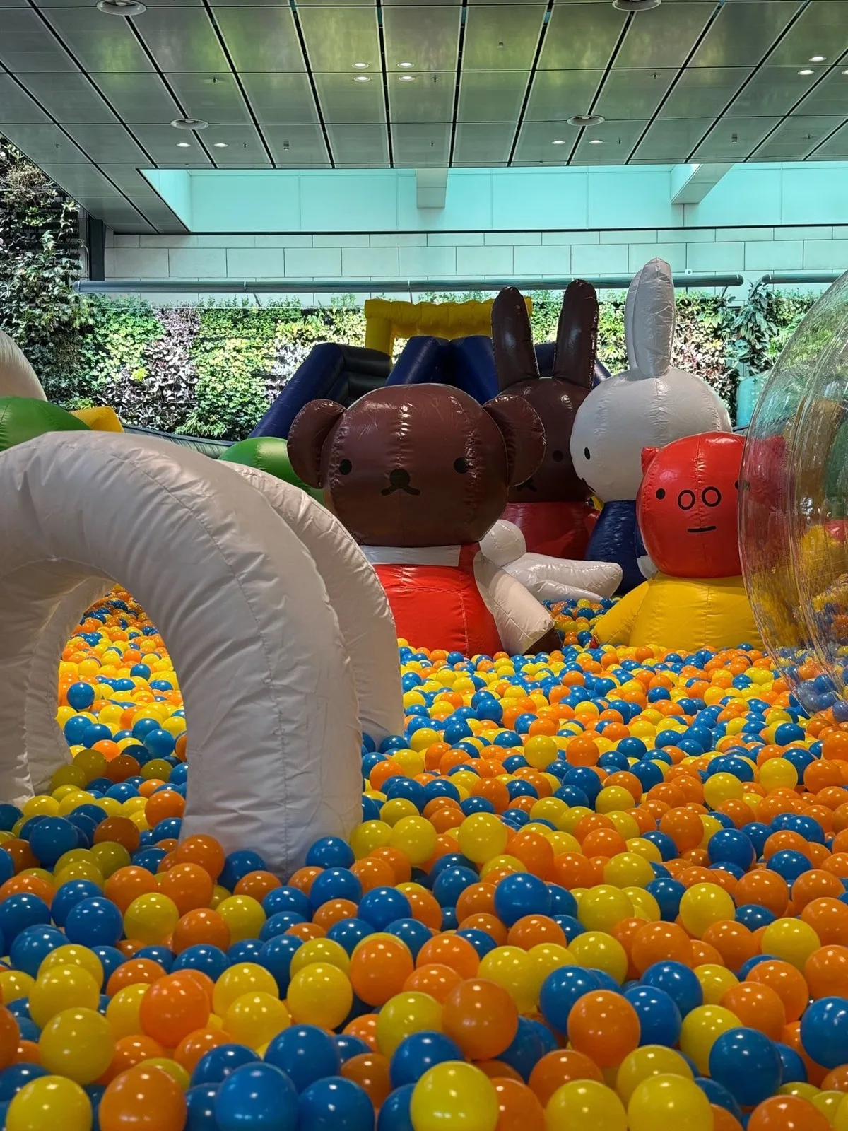 Miffy characters surrounded by colourful playground balls
